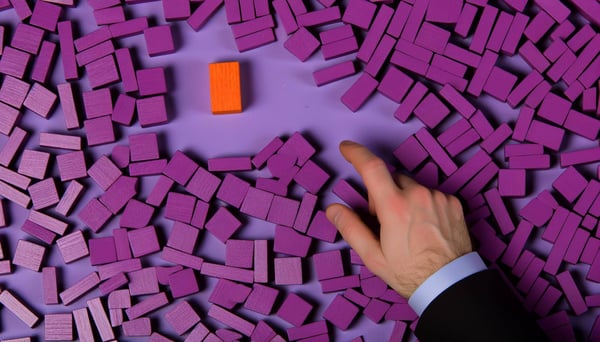 A mess of purple wooden blocks randomly scattered on a surface